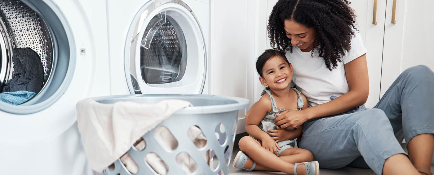 Mother and child in a laundry room