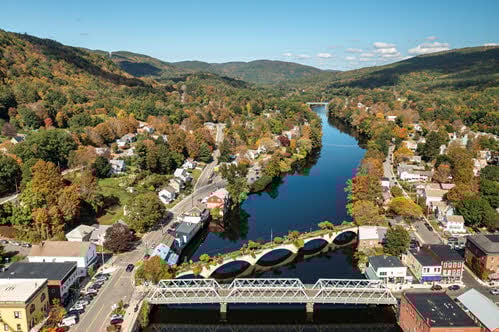 An aerial photo of a Massachusetts River, Bridge and habitat walkway