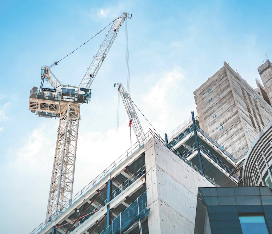 Building construction site and crane.